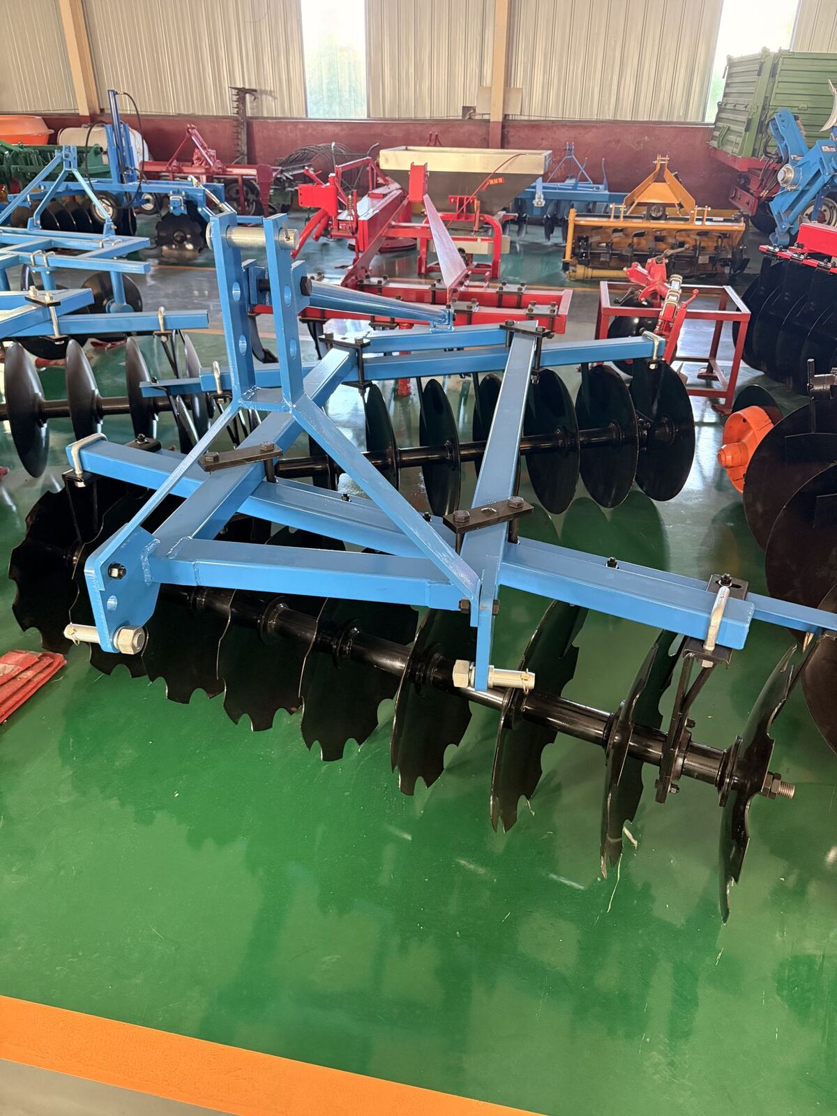 Disc harrows in an implements hall