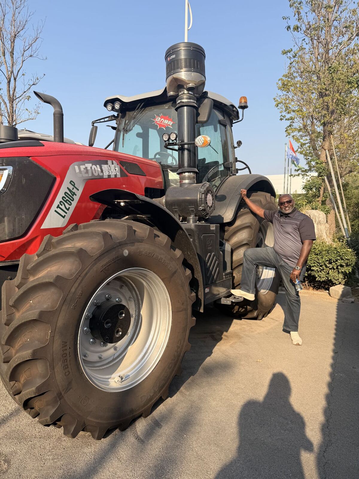 SunuBiz CEO beside a large tractor