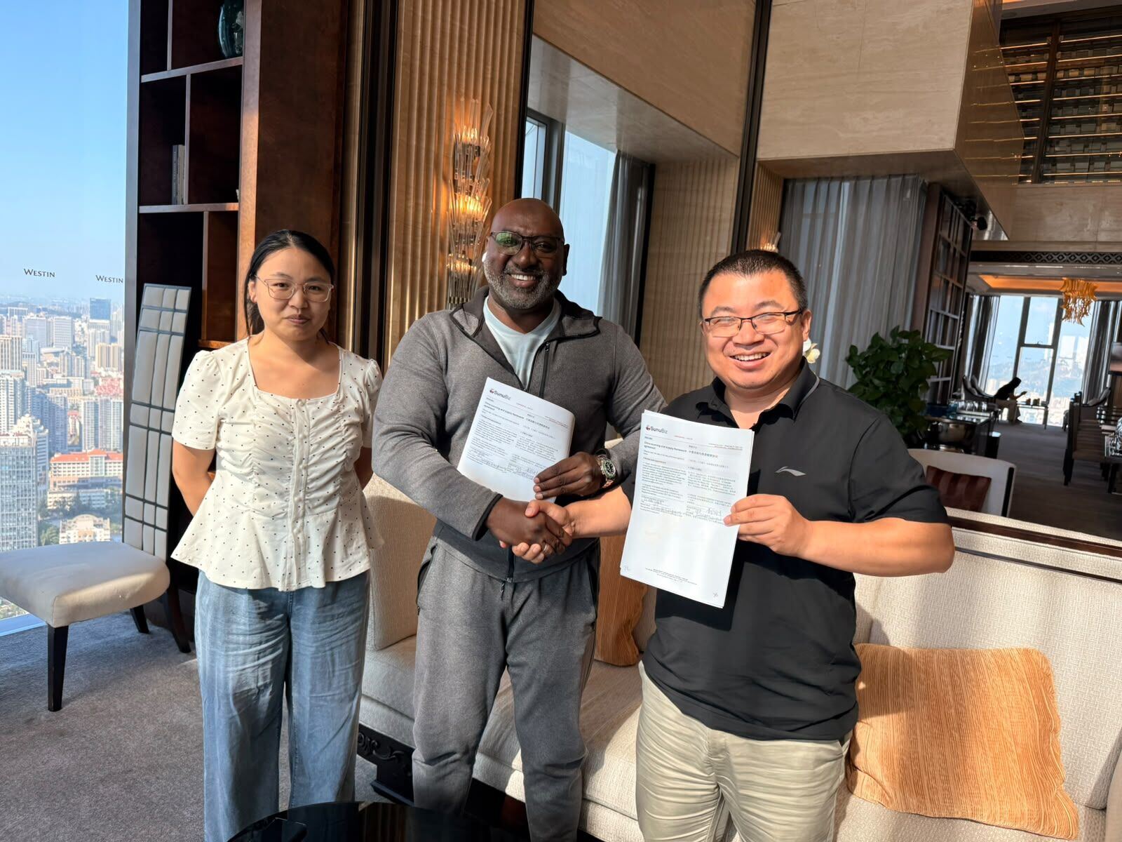 SunuBiz and Yucheng Industry representatives after signing the agreement